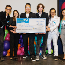 Student entrepreneurs with a huge winners check