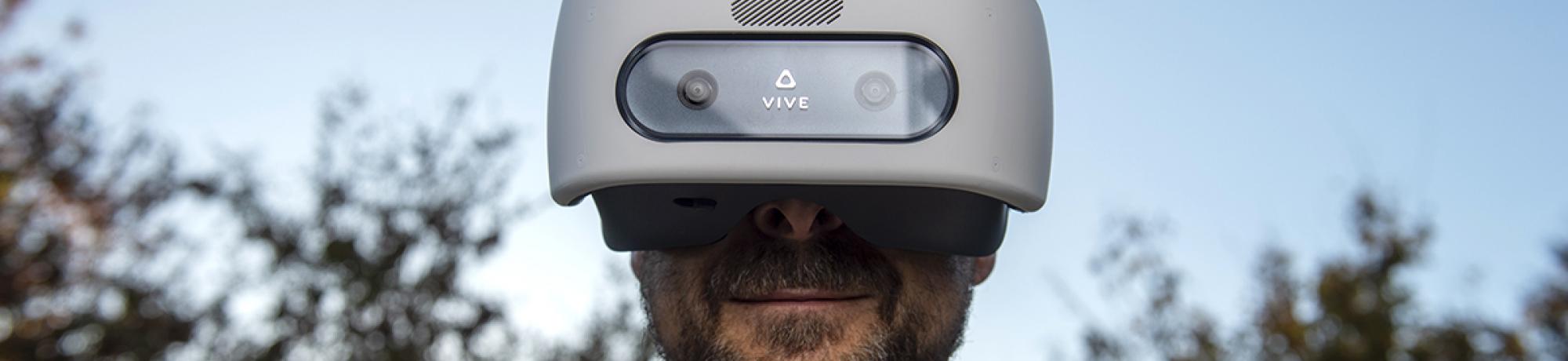 Professor Tony Simon demonstrating his virtual reality healthcare innovation VR device